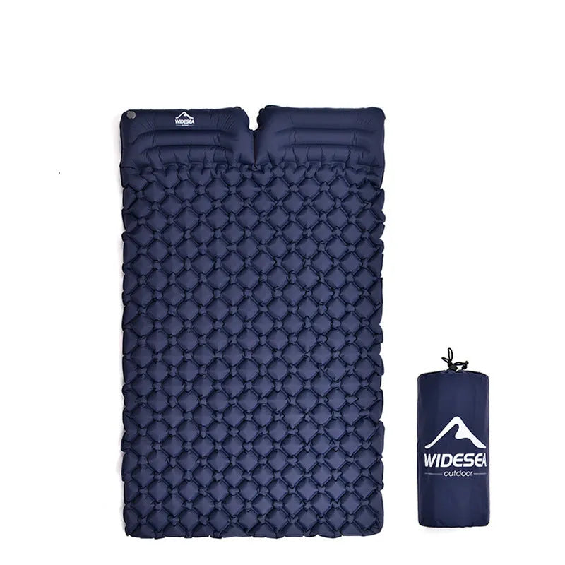 Green inflatable camping mat for two persons made from TPU nylon, shown outdoors on grass