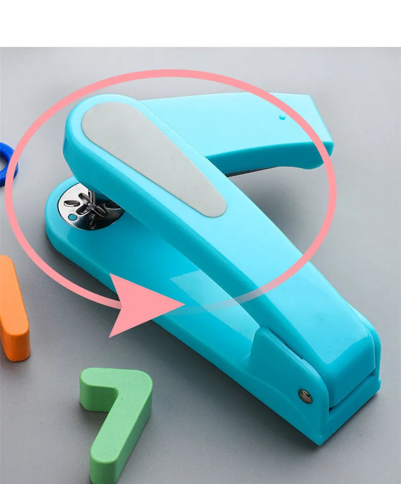 360-degree rotatable student stapler in multiple colours on a desk with paper