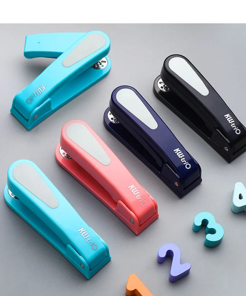 360-degree rotatable student stapler in multiple colours on a desk with paper