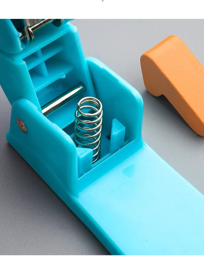 360-degree rotatable student stapler in multiple colours on a desk with paper