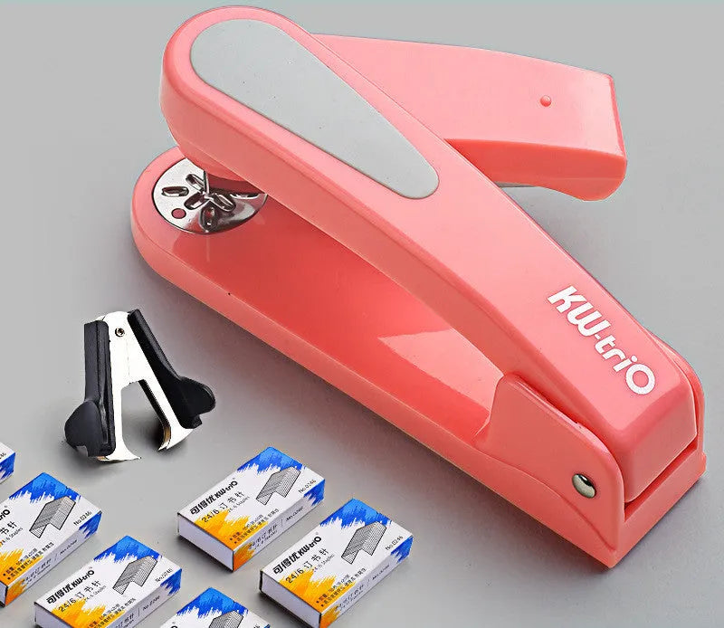 360-degree rotatable student stapler in multiple colours on a desk with paper