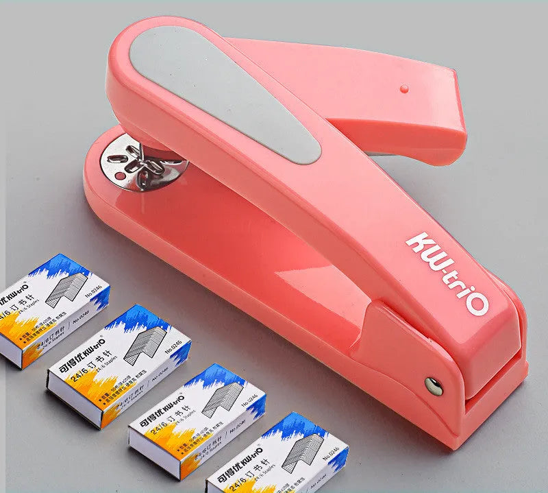 360-degree rotatable student stapler in multiple colours on a desk with paper