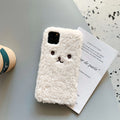 Brown TPU iPhone case with a soft embroidered plush cartoon bear face on the back.