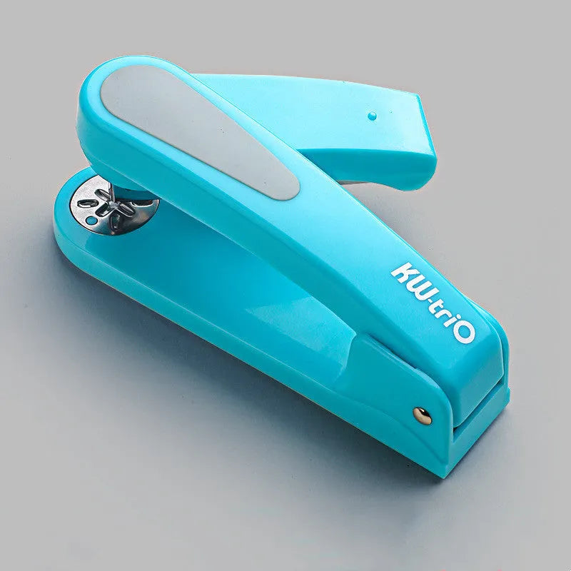 360-degree rotatable student stapler in multiple colours on a desk with paper