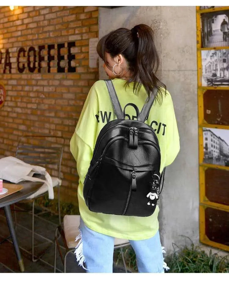Black soft PU leather backpack with double straps showing 24cm size and plain pattern