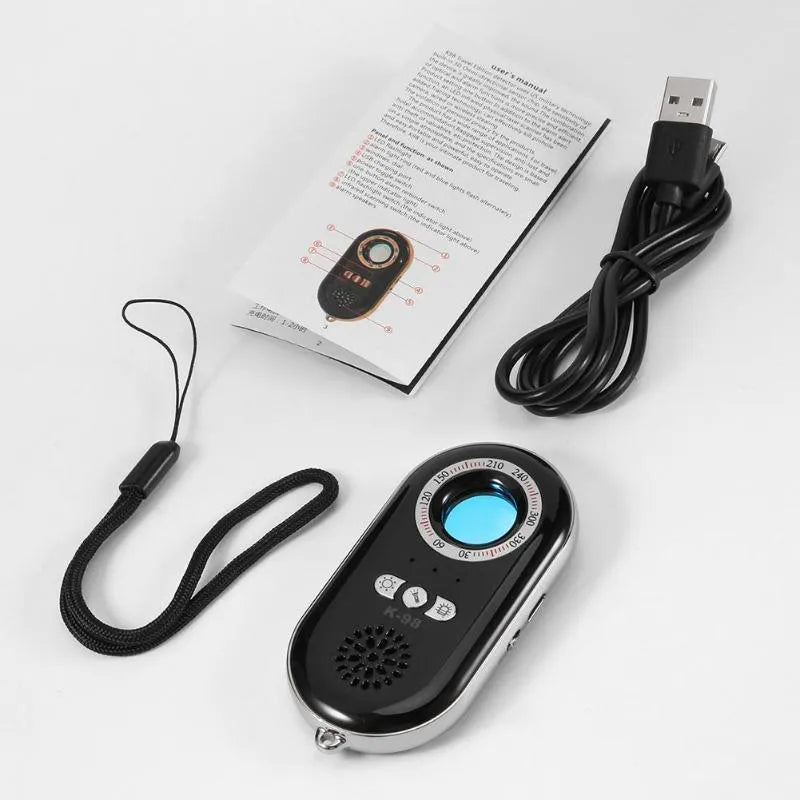 Compact white wireless signal detector for travel security with vibration alarm