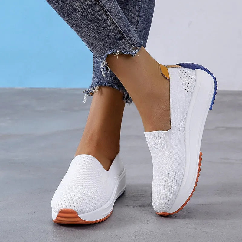 Women's lightweight mesh running shoes in white with composite sole, side view