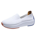 Women's lightweight mesh running shoes in white with composite sole, side view