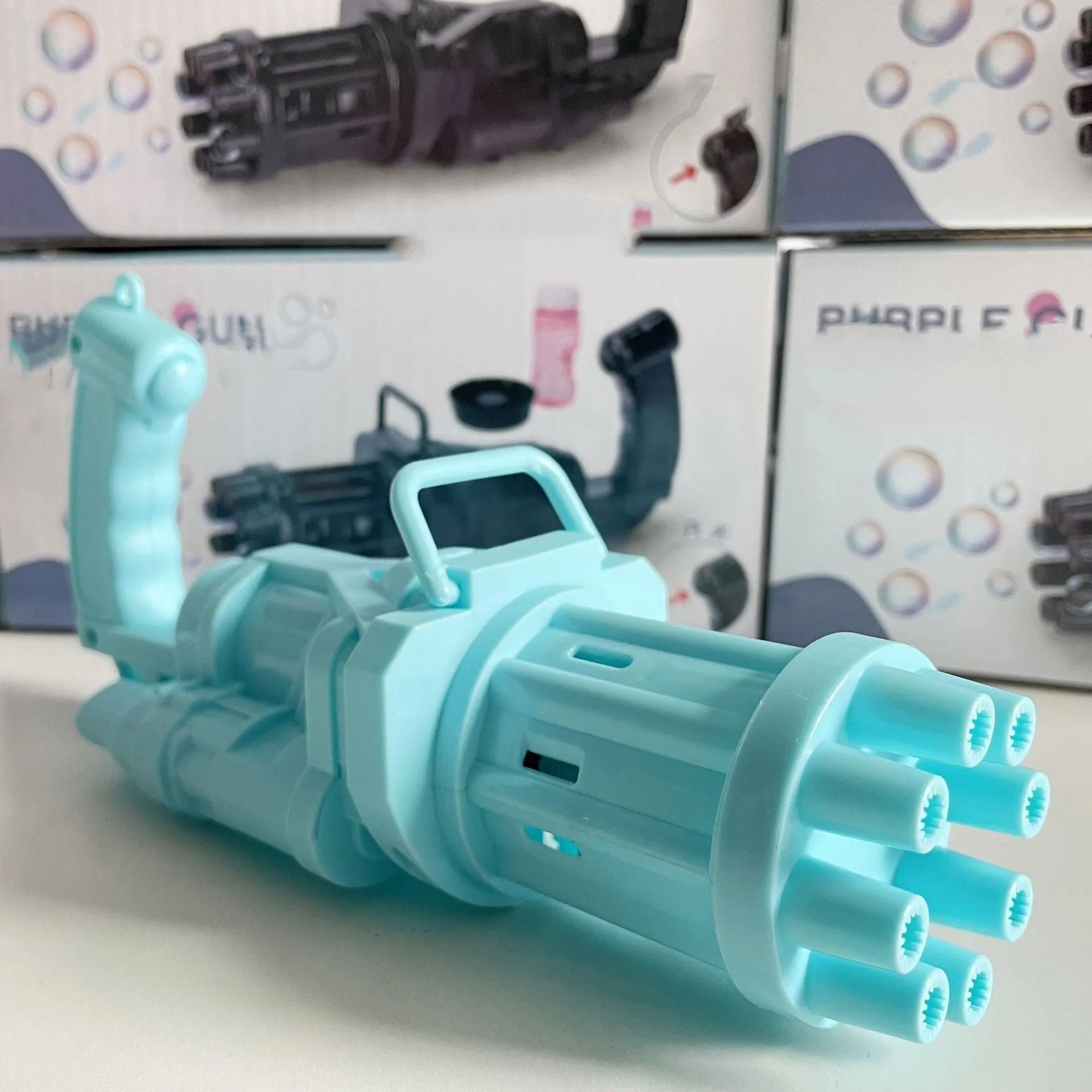 Children's bubble machine gun toy in pink, gold, or black colours with battery compartment and bubble solution.