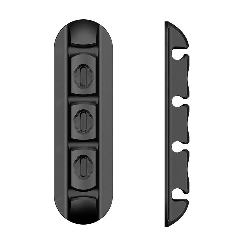 Black soft plastic desktop charging magnetic data cable organiser for cable management
