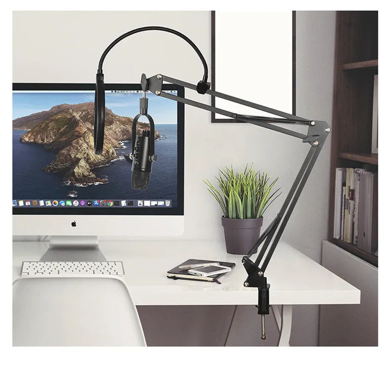 Black BM-86PRO USB condenser microphone on a metal stand with foam wind cover attached.