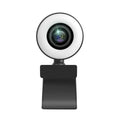 White USB computer webcam with a built-in ring of LED lights and a wide-angle lens on a monitor