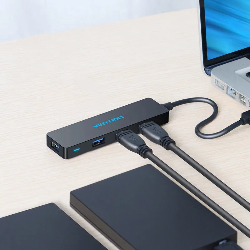 Black four-port USB 3.0 hub with 0.15 metre cable and nickel-plated connectors