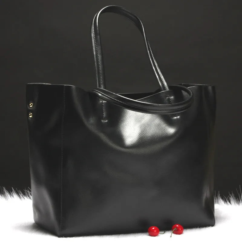 Women's leather shoulder bag in silver colour with adjustable strap showing 34cm length