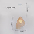 Snail-shaped rattan pendant light with woven grass and rattan shade, 350mm diameter, LED source, adjustable height, on a dark background
