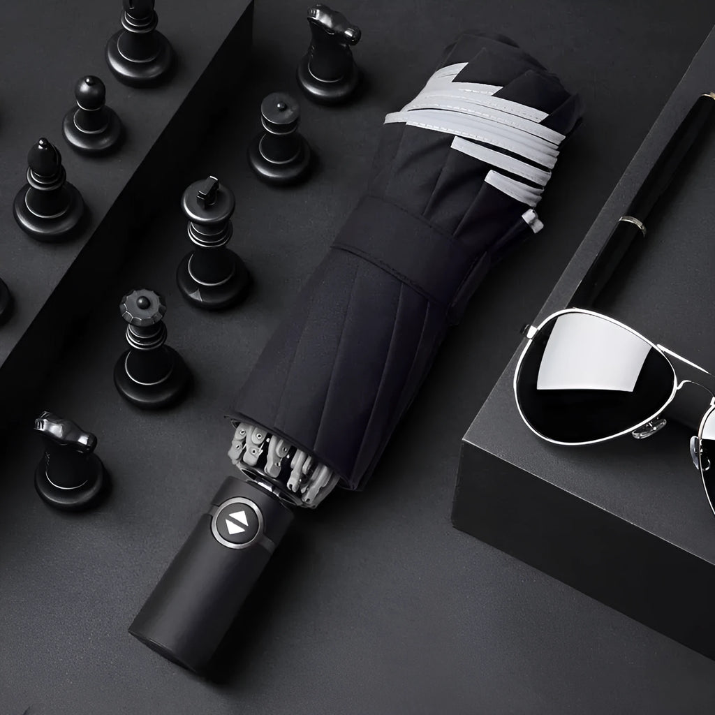 Black automatic reverse umbrella showing inward-folding design with plastic non-slip handle