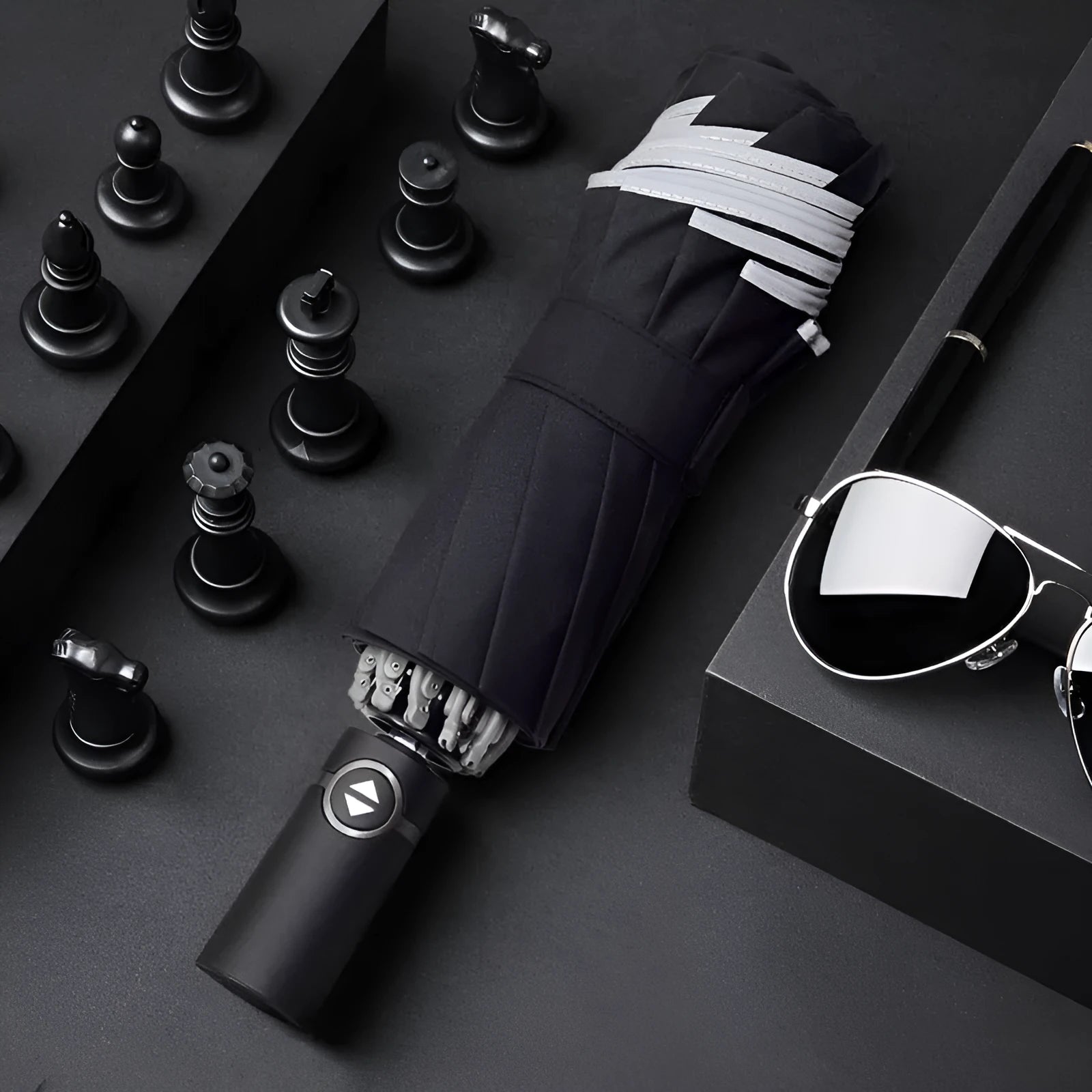Black automatic reverse umbrella showing inward-folding design with plastic non-slip handle