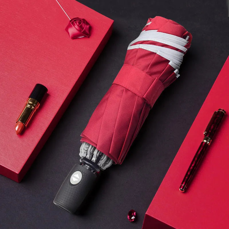 Black automatic reverse umbrella showing inward-folding design with plastic non-slip handle
