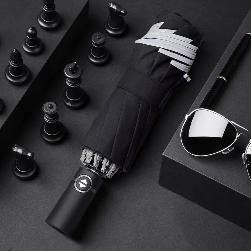 Black automatic reverse umbrella showing inward-folding design with plastic non-slip handle