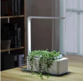 White plastic self-absorbent hydroponic planting box with LED grow lights and water alarm