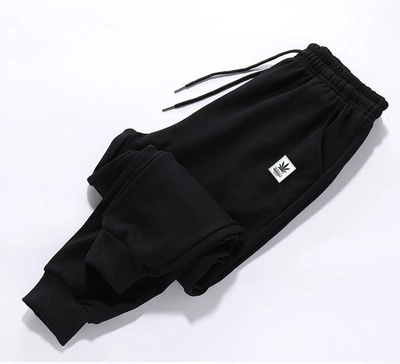 Mens loose fit casual trousers in polyester fabric, nine length, mid waist, small leg opening, available in multiple colours and sizes