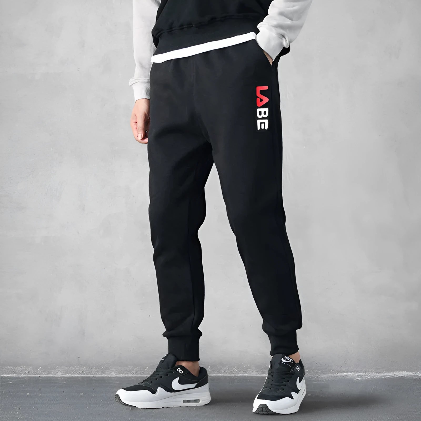 Mens loose fit casual trousers in polyester fabric, nine length, mid waist, small leg opening, available in multiple colours and sizes