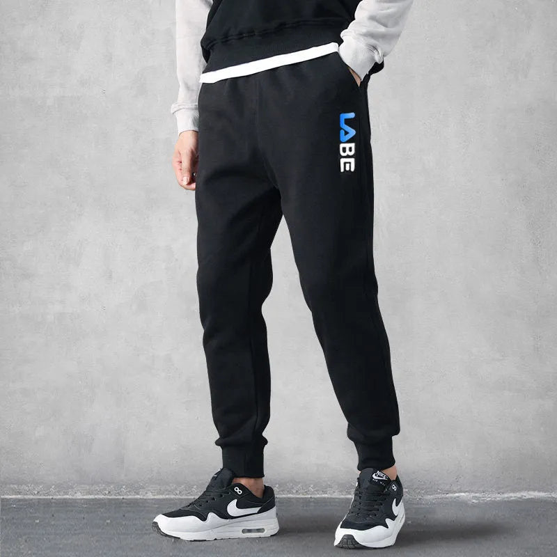 Mens loose fit casual trousers in polyester fabric, nine length, mid waist, small leg opening, available in multiple colours and sizes