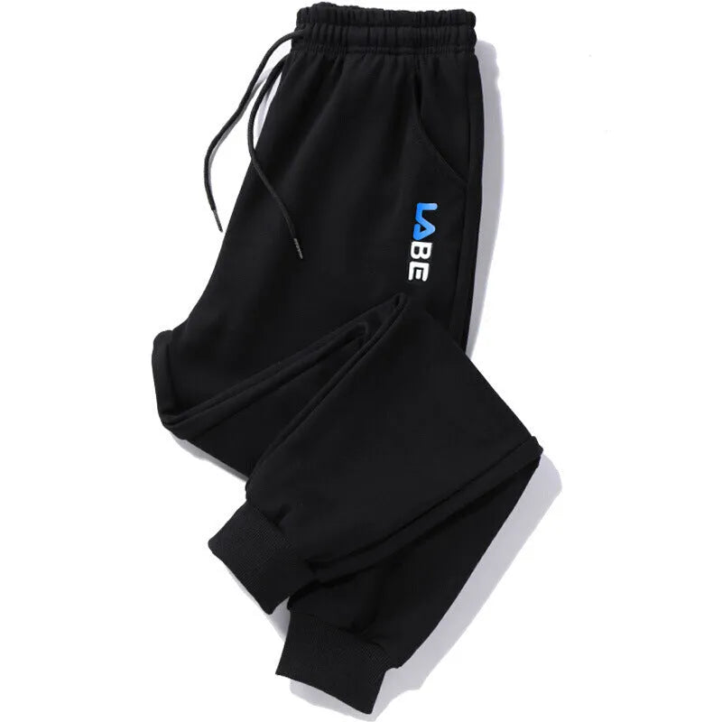 Mens loose fit casual trousers in polyester fabric, nine length, mid waist, small leg opening, available in multiple colours and sizes