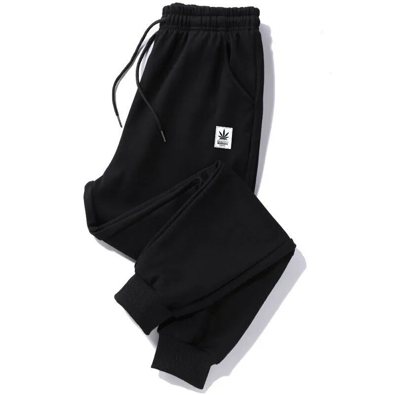 Mens loose fit casual trousers in polyester fabric, nine length, mid waist, small leg opening, available in multiple colours and sizes