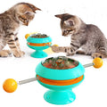 Rotatable interactive cat toy with suction cup base in lake blue, yellow, green, or pink.