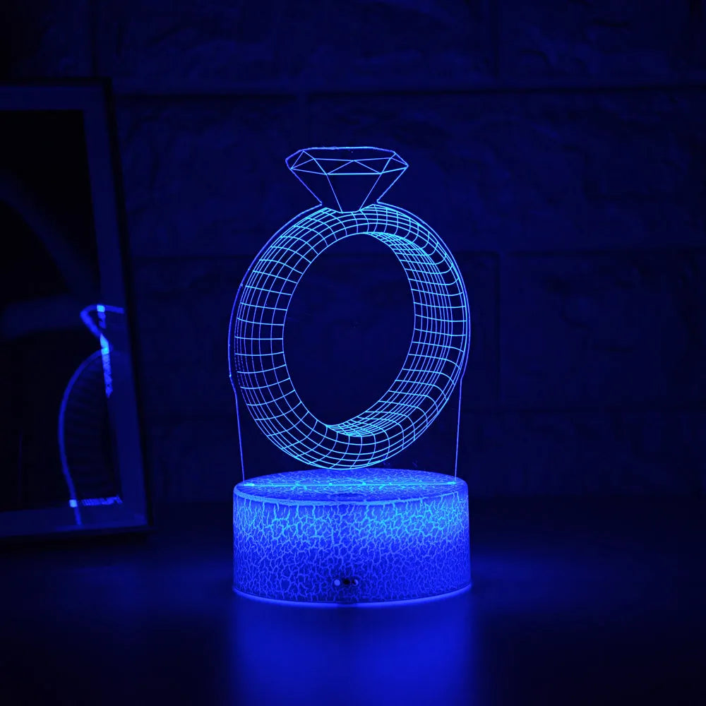 3D diamond ring LED night light with colour changing modes on black background
