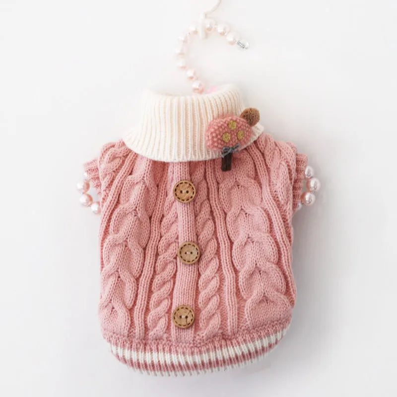Classic knitted pet sweater for small dogs in a sweet pink colour with twist button fastening
