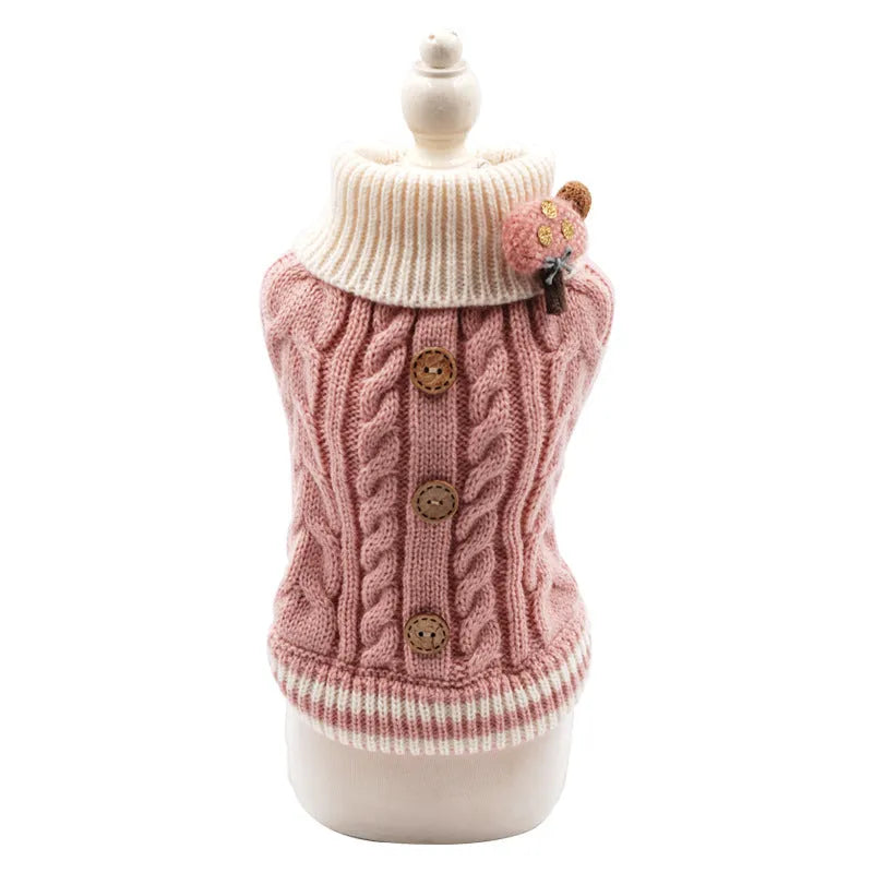 Classic knitted pet sweater for small dogs in a sweet pink colour with twist button fastening