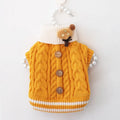 Classic knitted pet sweater for small dogs in a sweet pink colour with twist button fastening