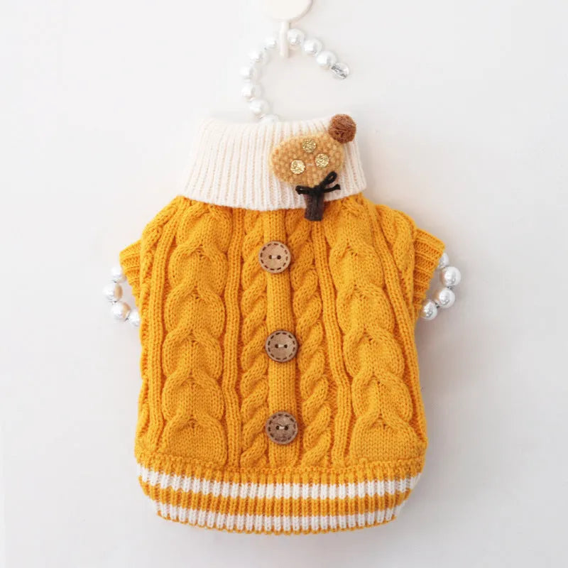 Classic knitted pet sweater for small dogs in a sweet pink colour with twist button fastening