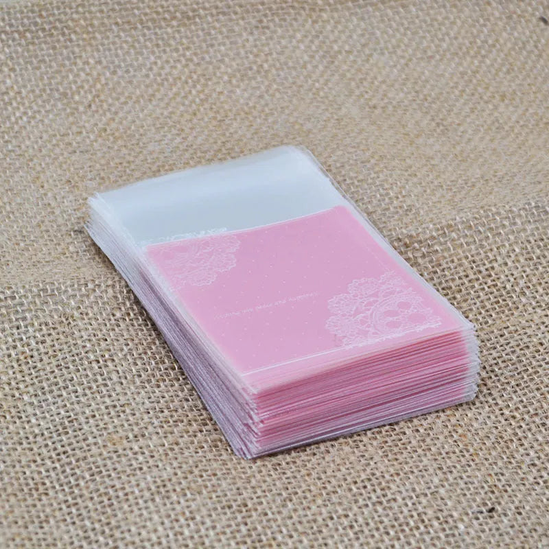 Pink self-adhesive plastic packaging bags for handmade soaps, 7cm by 7cm with 3cm flap