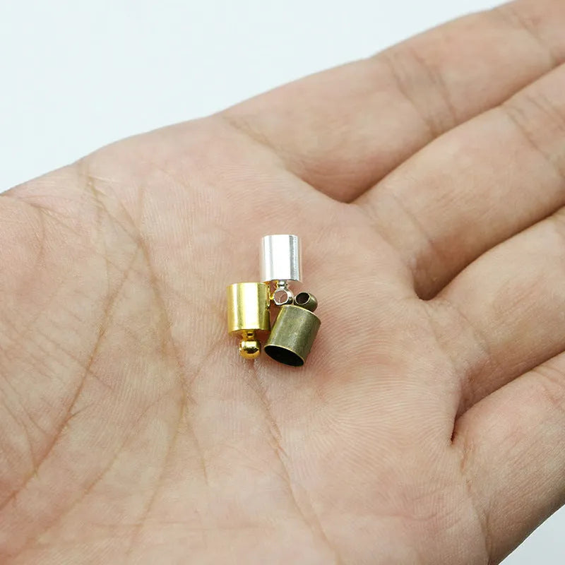 Assorted copper bell weight caps and tassel caps in various electroplated colours and sizes for jewellery making.