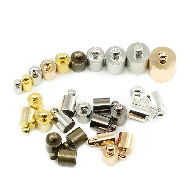 Assorted copper bell weight caps and tassel caps in various electroplated colours and sizes for jewellery making.