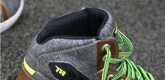 Black and grey motorcycle short boots showing breathable design with anti-slip soles for rider safety