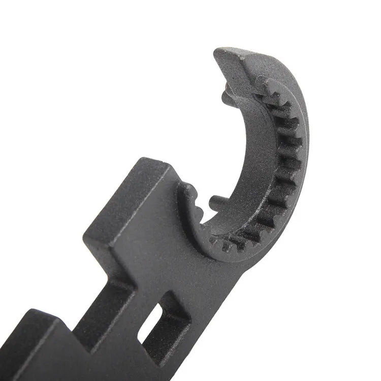 Black steel combination wrench for AR15 and M4 rifles on a plain background.