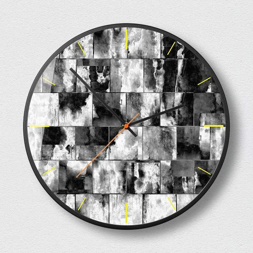 Round abstract art wall clock with metal frame and black pattern designs showing sweep second hand