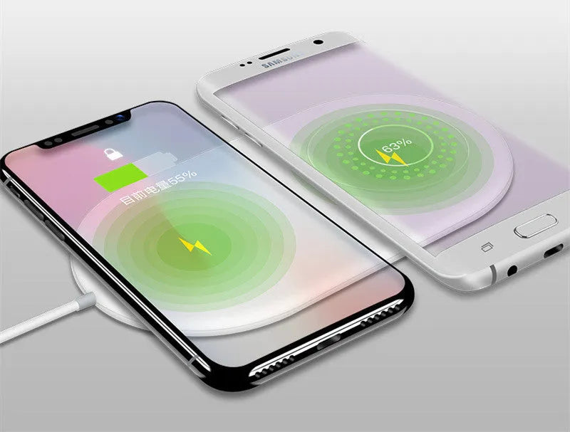 White dual wireless charger charging two mobile phones side by side