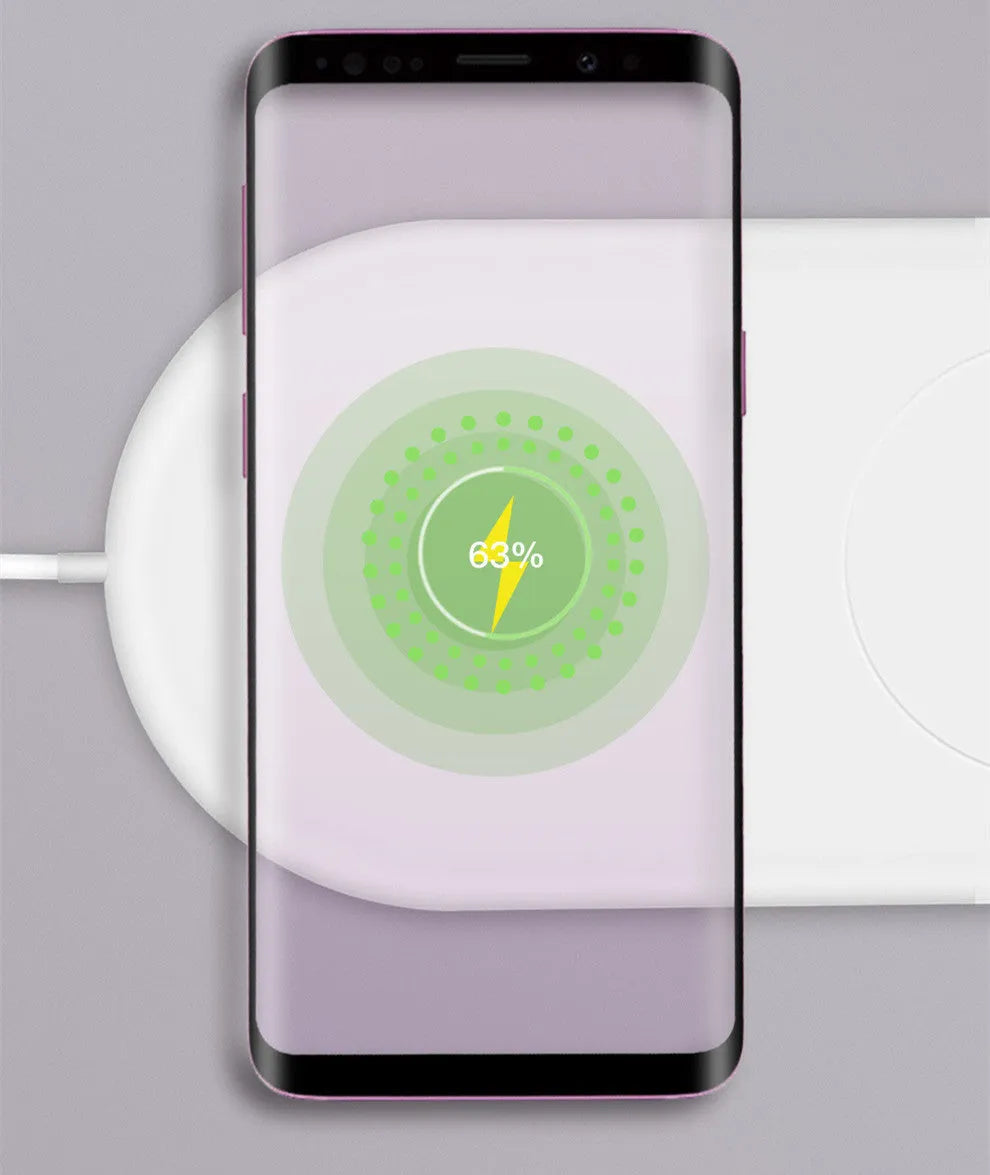 White dual wireless charger charging two mobile phones side by side