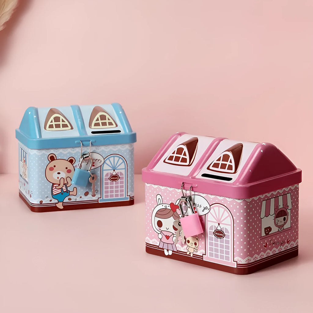 Blue house-shaped tinplate piggy bank on a wooden desk surface.