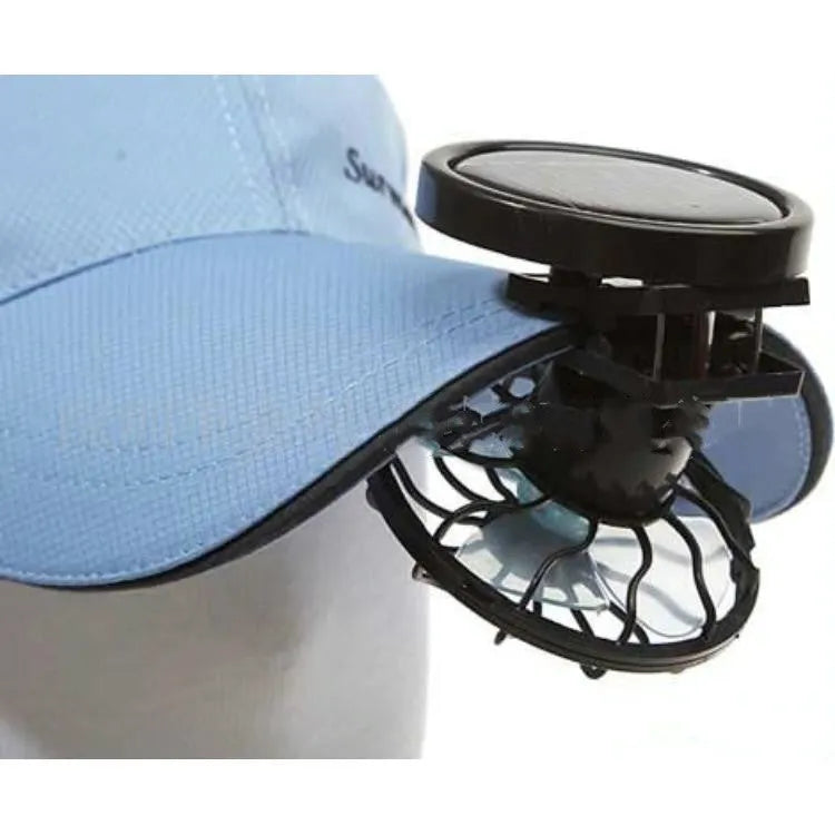 Black solar-powered clip fan with rectangular solar panel for outdoor cooling