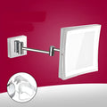 8.5 inch stainless steel folding makeup mirror in antique black finish on a vanity.
