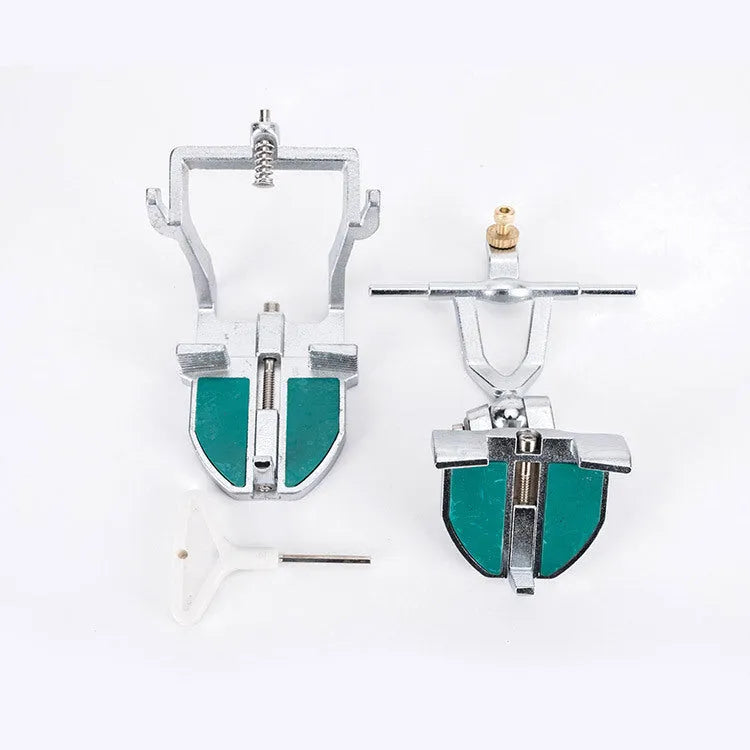 Korean dental laboratory articulator with adjustable arms for mounting adult jaw models.