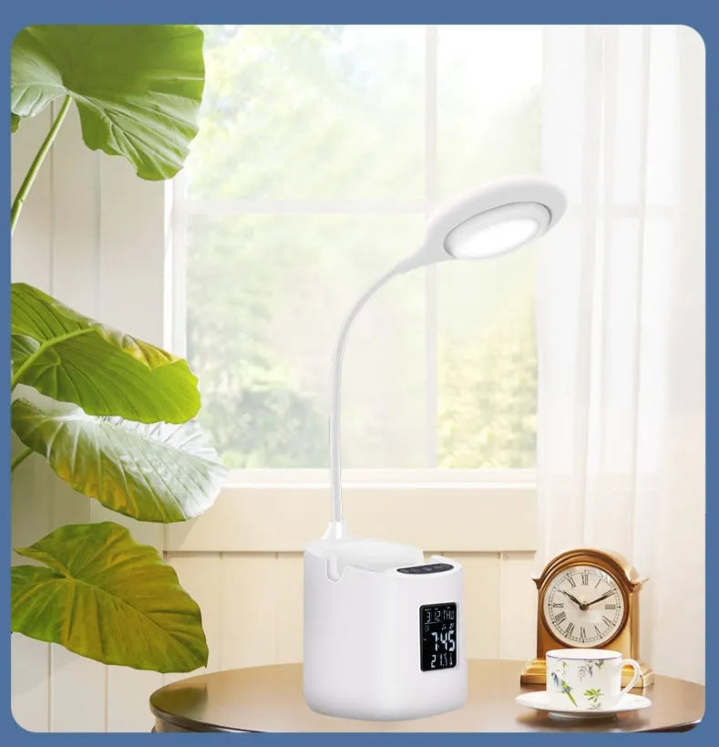 White USB desk lamp with touch switch control on a wooden desk.