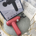 God fascia gun muscle massager in black colour with USB charging port
