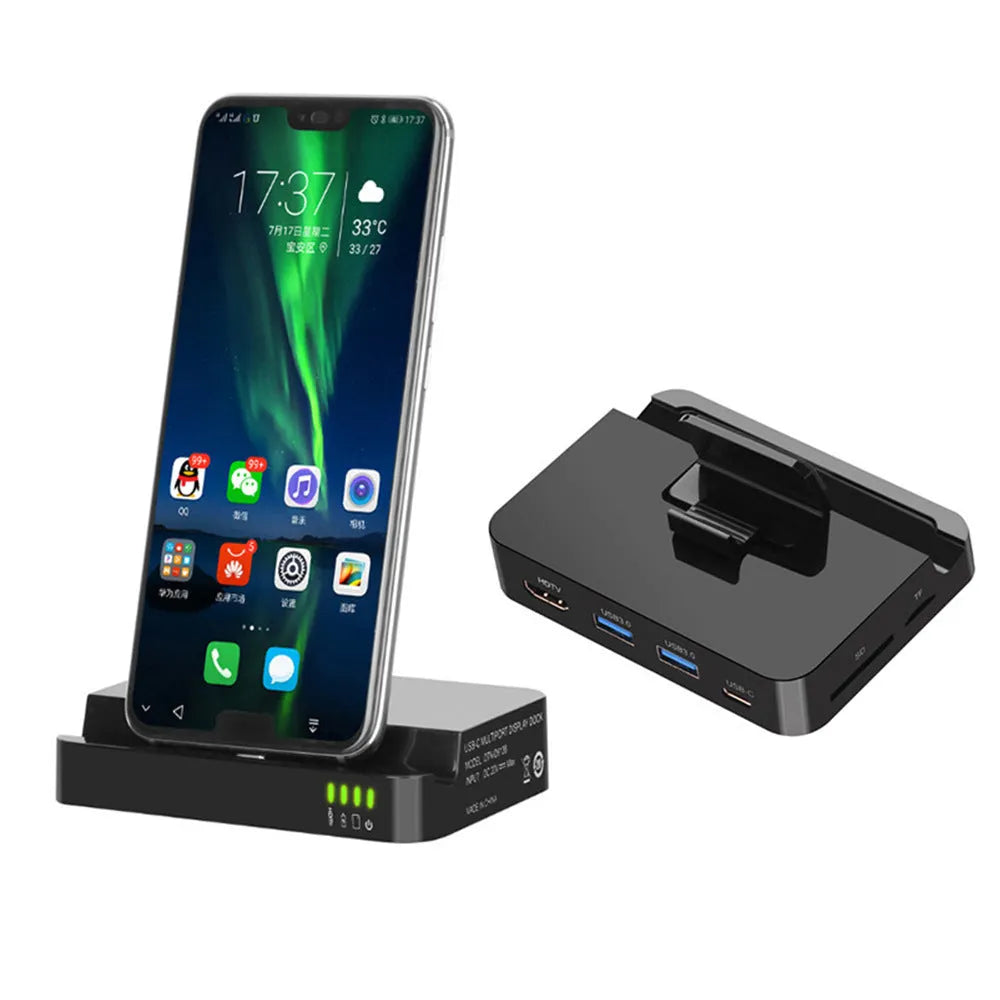 Black base mobile phone to HDMI converter dock for presentations on a desk.
